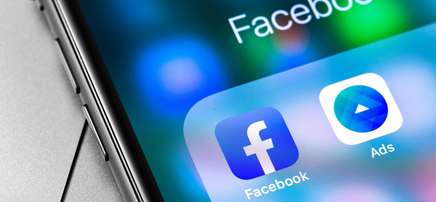 FacebookAds-Hero Phone screen showing Facebook app button