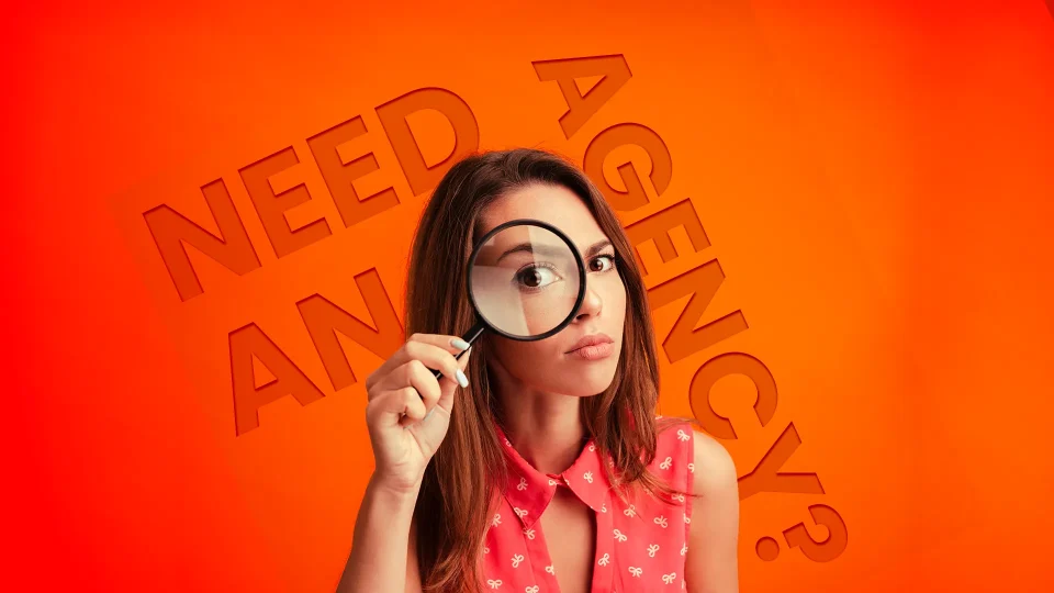 needandagency copy Lady holding magnifying glass to her face